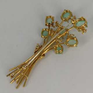 Designer brooch in gold with tourmalines and diamonds
