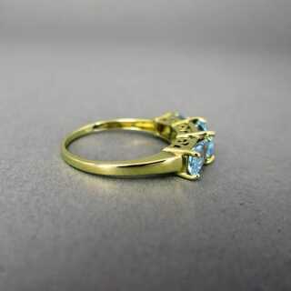 Unique ladys gold ring with blue topaz baquettes open worked ring head design