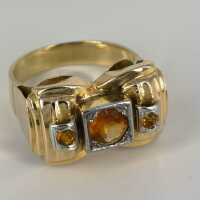 Solid 18 carat ladies gold ring with citrines in an...