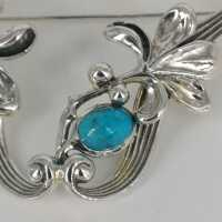 Beautiful openwork brooch in silver with turquoise