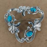 Beautiful openwork brooch in silver with turquoise