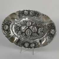 Oval silver bowl with pomegranate decoration in repousse...