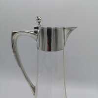 Simple Art Nouveau glass carafe with silver fittings