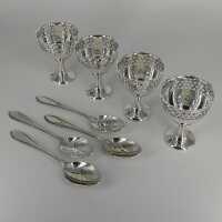Set with 4 egg cups with holder and 4 teaspoons around 1920