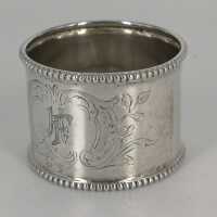 Art Nouveau napkin ring in silver with rocailles decor and monogram