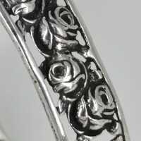 Antique silver bangle with openwork rose decor