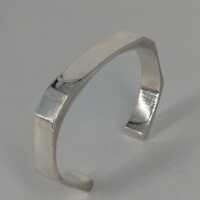 Modernist bangle in abstract form in solid silver