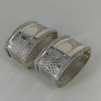 A pair of beautiful openwork napkin rings in solid silver