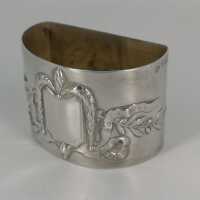 Art Nouveau napkin ring in silver with relief decoration...