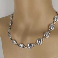 Beautiful designer necklace with abstract floral elements in solid silver