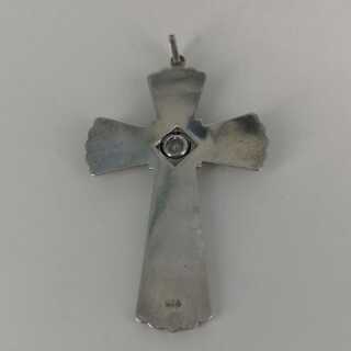 Cross pendant in silver with a sparkling spinel