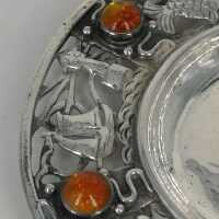 Openwork small art nouveau plate in silver and amber