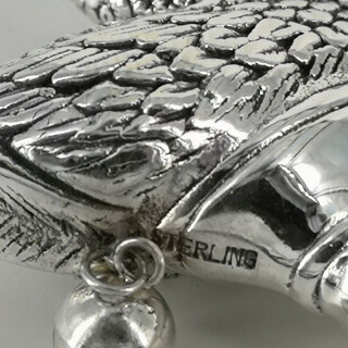 The wonderful swan from a fairy tale as a childrens rattle in silver