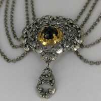 Vintage traditional jewellery necklace in silver and gold with garnet trim