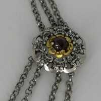 Vintage traditional jewellery necklace in silver and gold with garnet trim