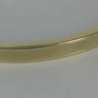 Elegant classic bangle in gold with herringbone pattern