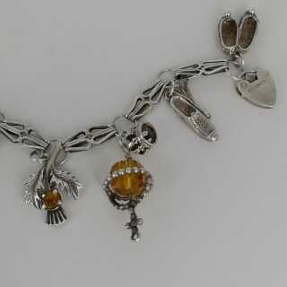 Vintage charm bracelet in silver with many charms
