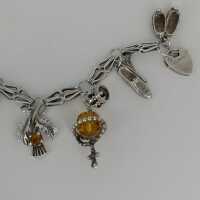 Vintage charm bracelet in silver with many charms