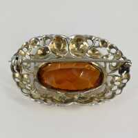 Vintage brooch in silver with caramel coloured glass stone around 1950
