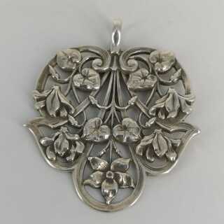 Large art nouveau pendant in silver with floral motifs