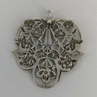 Large art nouveau pendant in silver with floral motifs