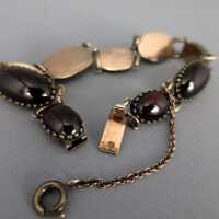 Vintage Gliederarmband mit ovalen Granatsteinen in Silber und Gold