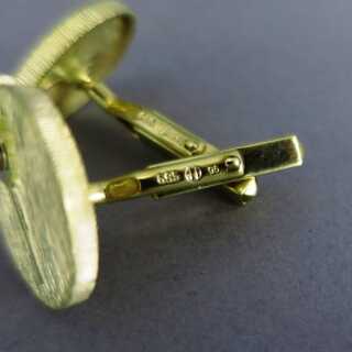 Modernistic gold cufflinks with diamonds