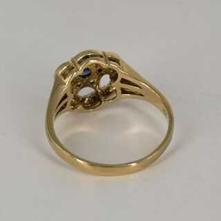Pretty openwork gold ring for ladies with sapphire and diamonds