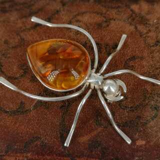 Vintage brooch in silver with large amber in the shape of a spider