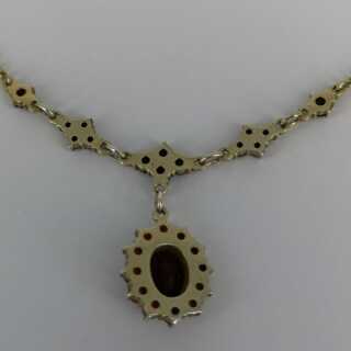 Beautiful delicate necklace with garnet stones in gold plated silver