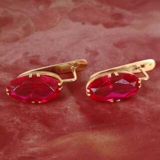 Beautiful gold earrings with bright red spinels
