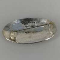 Magnificently decorated oval brooch in silver around 1960