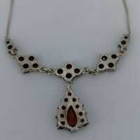 Beautiful delicate necklace with garnet stones in silver