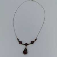Beautiful delicate necklace with garnet stones in silver